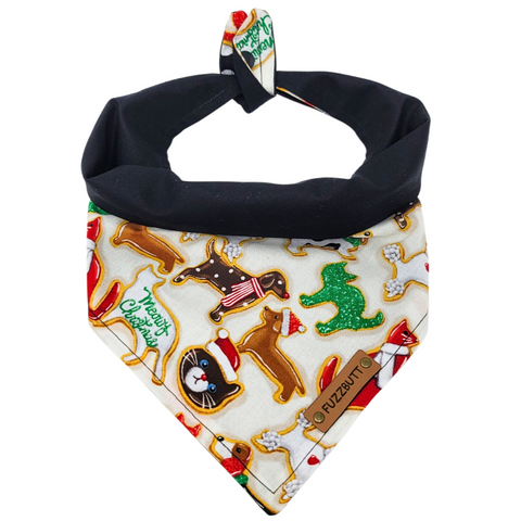 front view of a handmade Christmas Cookies dog bandana or Christmas Cookies cat bandana featuring various colors Christmas Cookies shaped like cats and dogs; this pattern is called Christmas Cookies