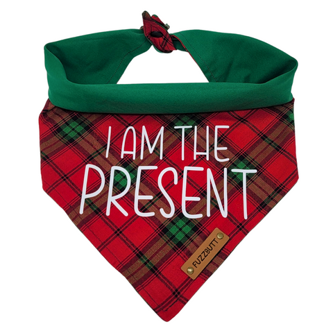 front view of a handmade Christmas plaid dog bandana or Christmas plaid cat bandana featuring red and green plaid and I am the present sign; this pattern is called I Am The Present