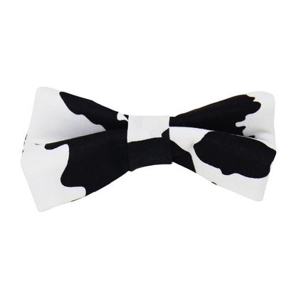 front view of a handmade Cow Print dog bow tie or Cow Print cat bow tie featuring cow print pattern; this pattern is called Cow Print